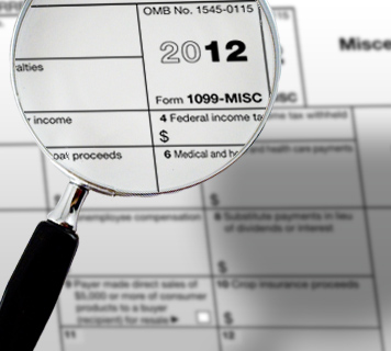 IRs form 1099 with magnifying glass